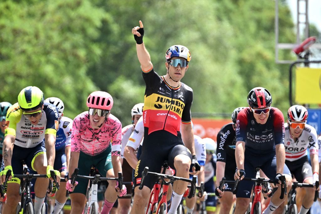 JumboVisma teams Belgian rider Wout Van Aert celebrates as he crosses the finish line and wins the first stage of the 74th edition of the Criterium du Dauphine cycling race 192 km between La VoultesurRhone and Beauchastel on June 5 2022 Photo by Marco BERTORELLO AFP Photo by MARCO BERTORELLOAFP via Getty Images