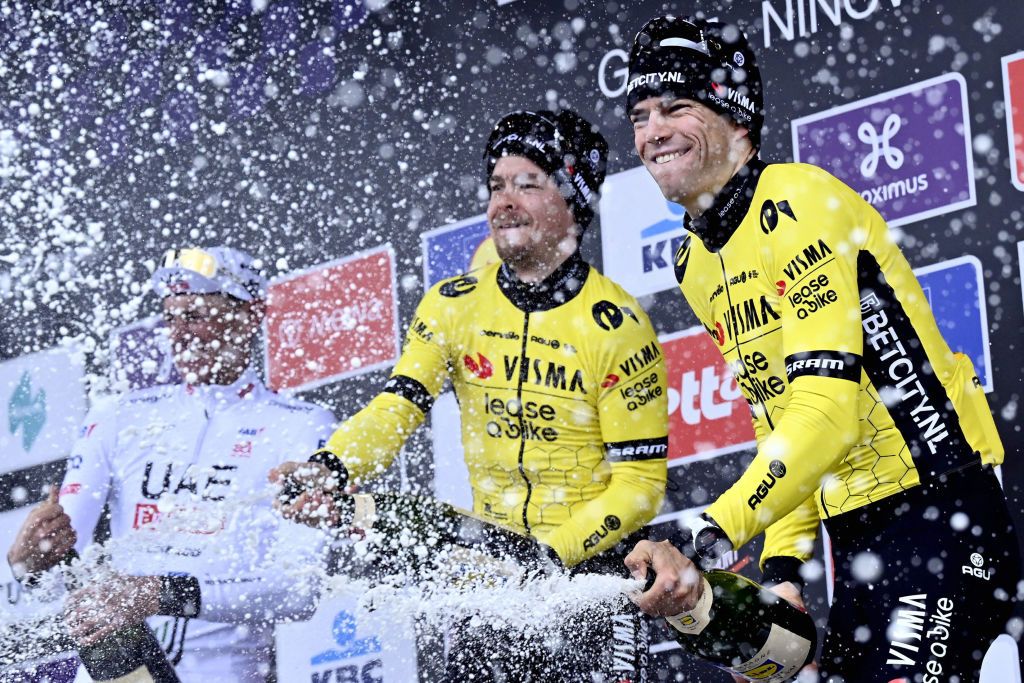 From left: German Nils Politt of UAE Team Emirates, Slovenian Jan Tratnik of Team Visma-Lease a Bike and Belgian Wout van Aert of Team Visma-Lease a Bike celebrate on the podium of the 79th edition of the men's one-day cycling race Omloop Het Nieuwsblad (UCI World Tour), 202km from Gent to Ninove on February 24, 2024. (Photo by DIRK WAEM / Belga / AFP) / Belgium OUT