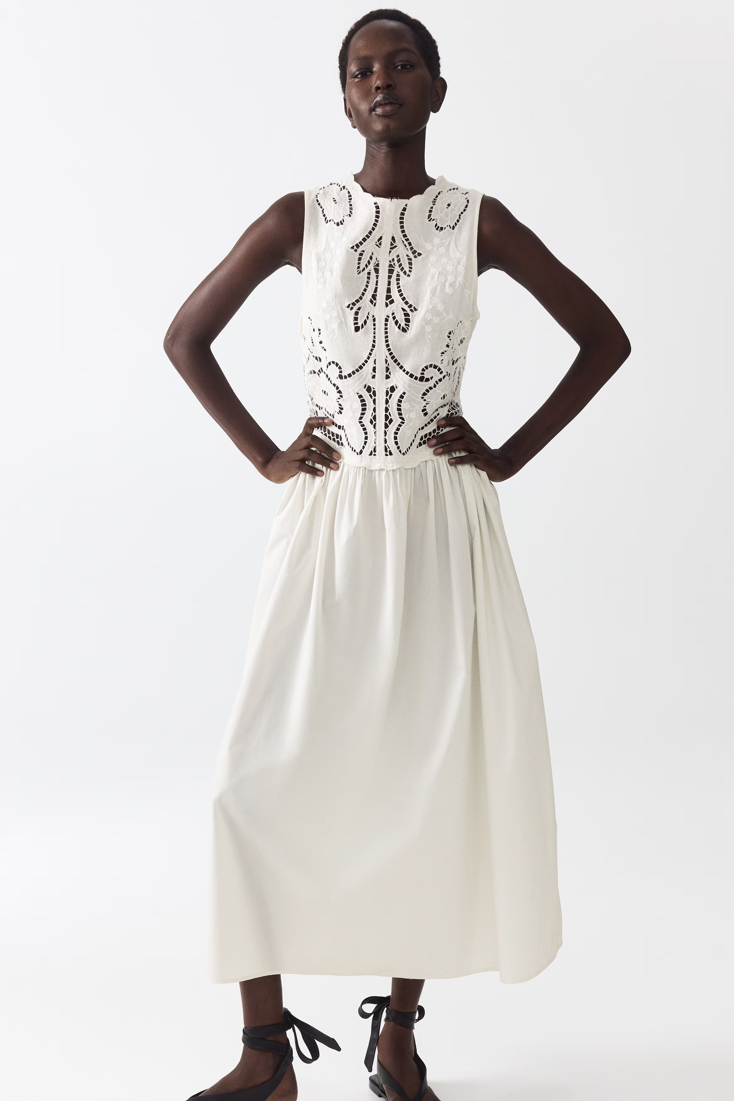 This Expensive-Looking H&amp;amp;M Dress Is About to be Everywhere, model shot of the H&amp;amp;M Embroidered Linen-blend Dress