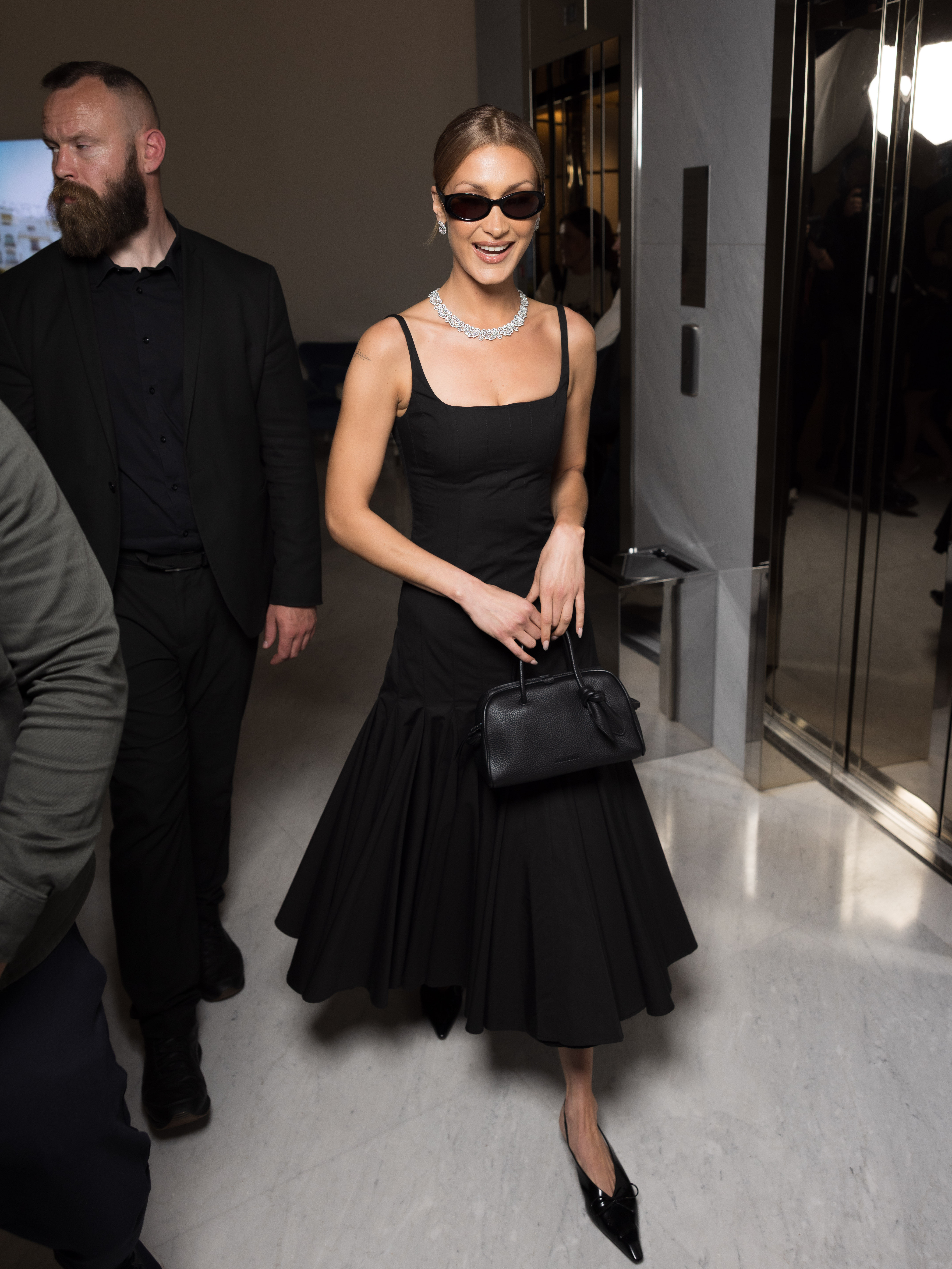 Bella Hadid wearing a black dress with knife point heels at cannes
