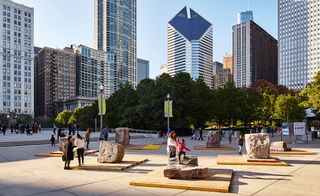 Large boulders on top of wooden plinths for children to play on