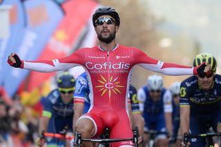 Cofidis' French cyclist Nacer Bouhanni celebrates as he crosses the finish line winning the fourth stage of the 97th Volta Catalunya