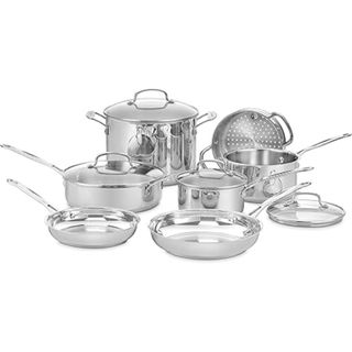 A set of stainless steel cookware with three saucepans, a large cooking pot, and two frying pans