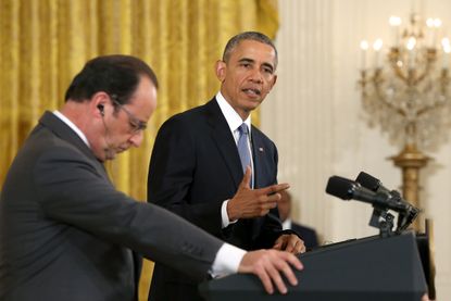 President Obama speaks as he and French President Francois Hollande hold a joint press conference in the East Room of the White House.