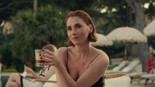 Anna Barton (Charlie Murphy) enjoys a drink in Netflix's Obsession