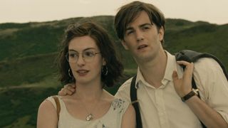 anne hathaway in glasses and jim sturgess on a hillside in the movie one day