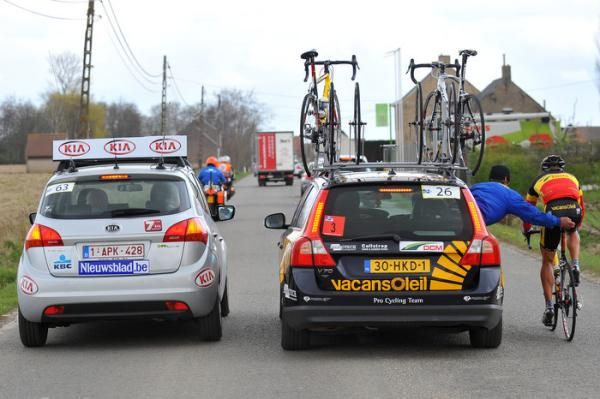Stijn Devolder (Vacansoleil-DCM) gets assistance from his team car.