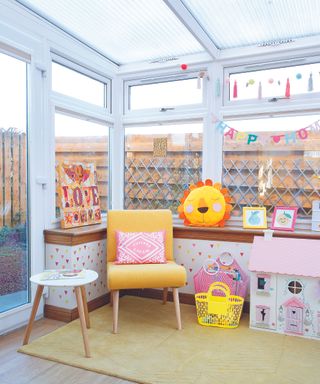 Yellow and pink play area in conservatory