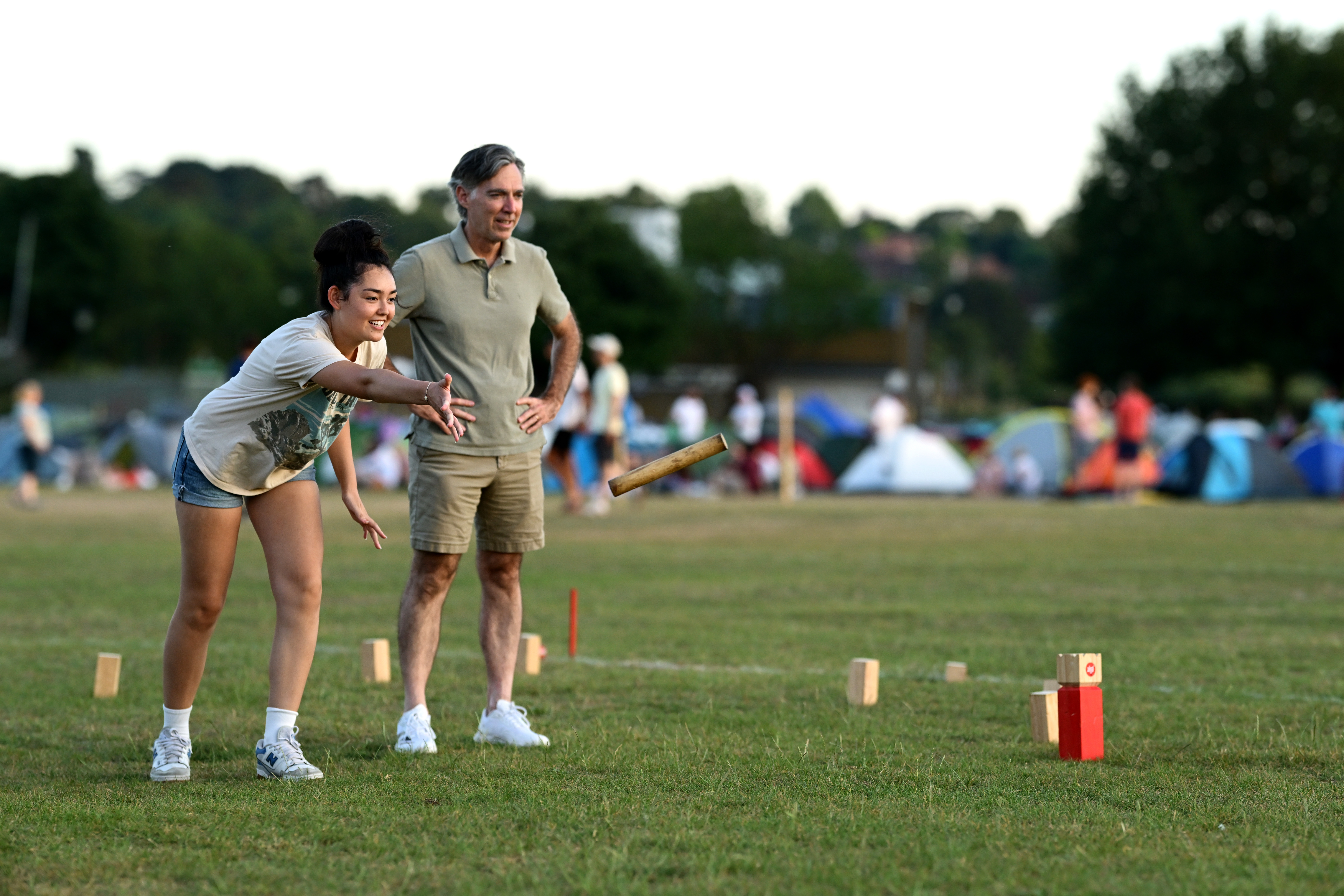 Spectators play games at The Queue Wimbledon Park the night before the start of The Championships Wimbledon 2025 at All England Lawn Tennis and Croquet Club