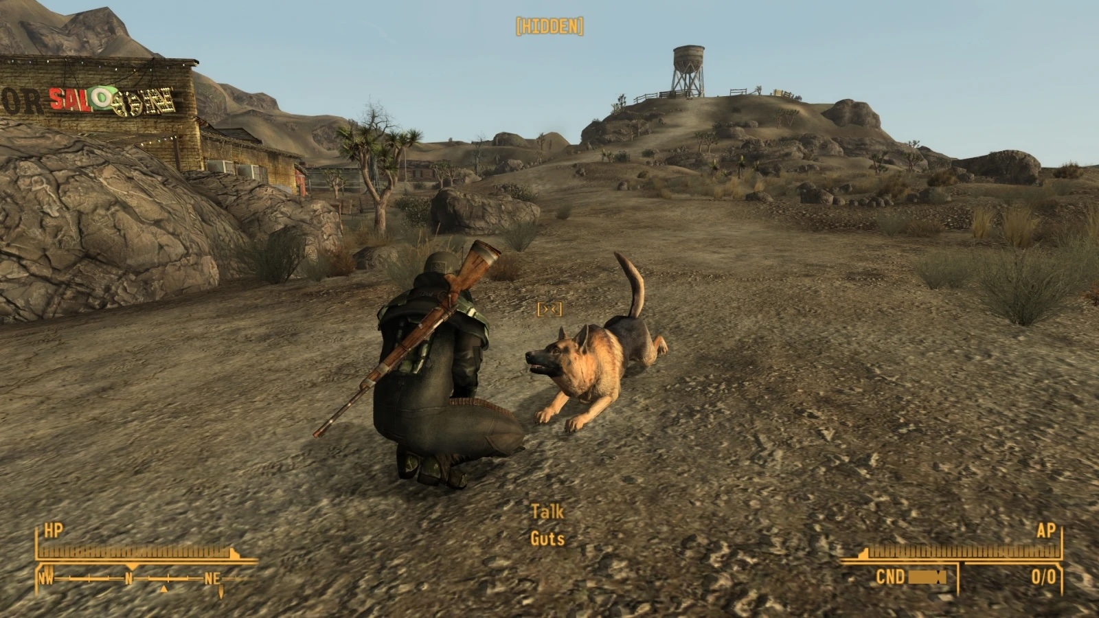 Ranger crouches with dog.