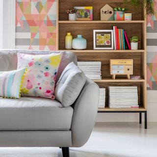sofa with cushions and floral print cushion with shelves