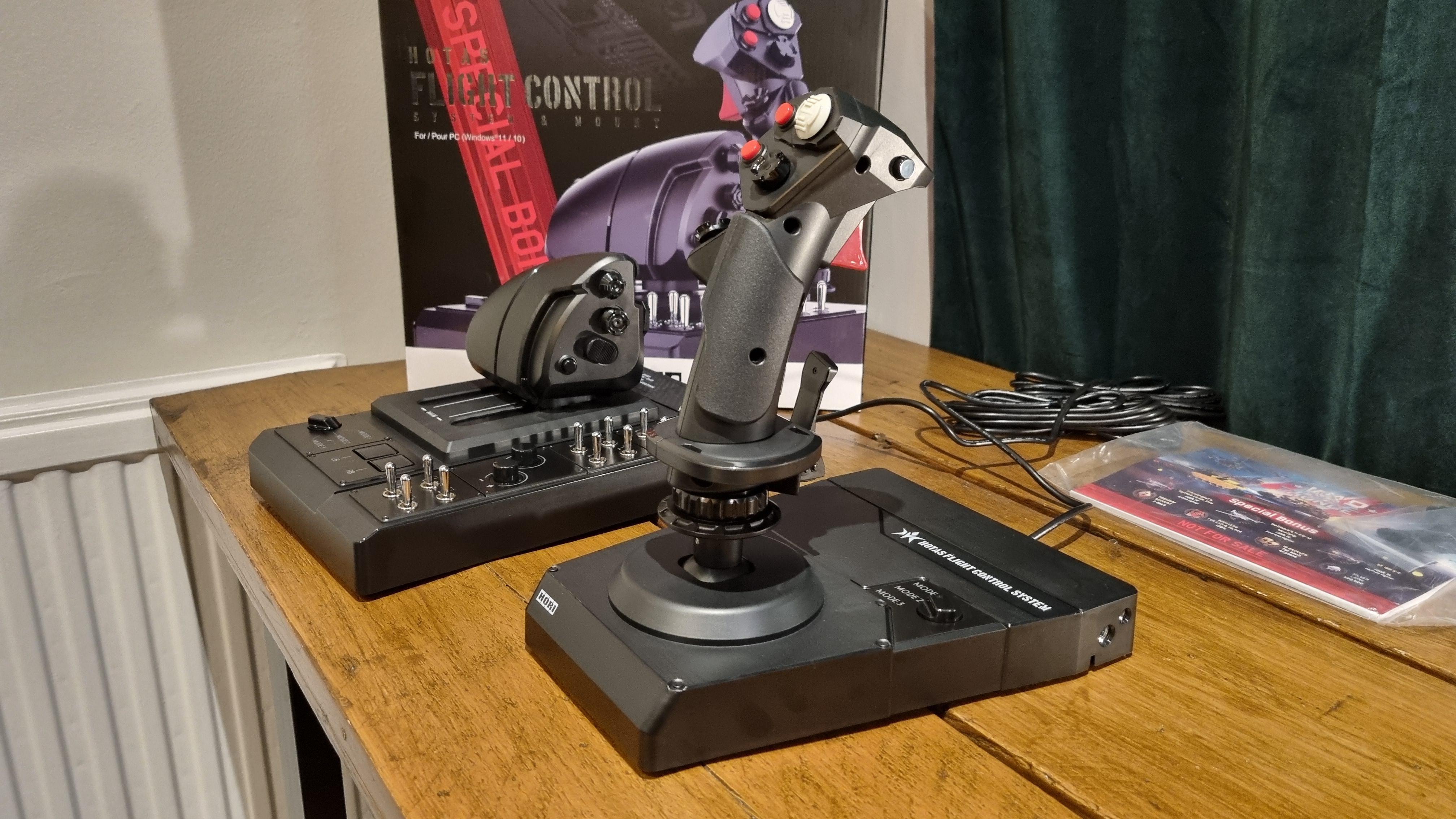 The Hori HOTAS flight control system in profile on a desk