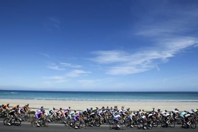 The peloton rides by Aldinga Beach during the Tour Down Under