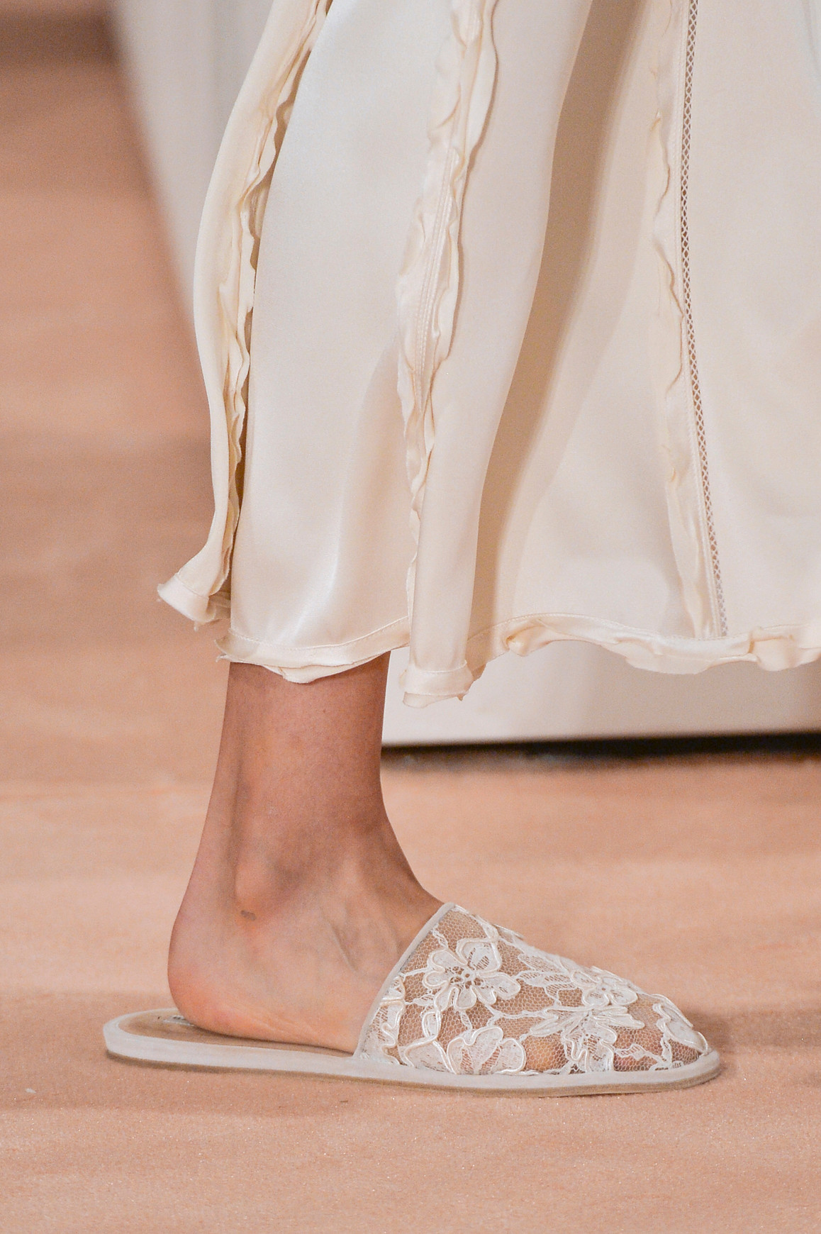 The embellished mesh slipper fashion trend summer 2026. Image of the Balenciaga Spring/summmer 2016 fashion show where the white shoes where showcased by Alexander Wang.