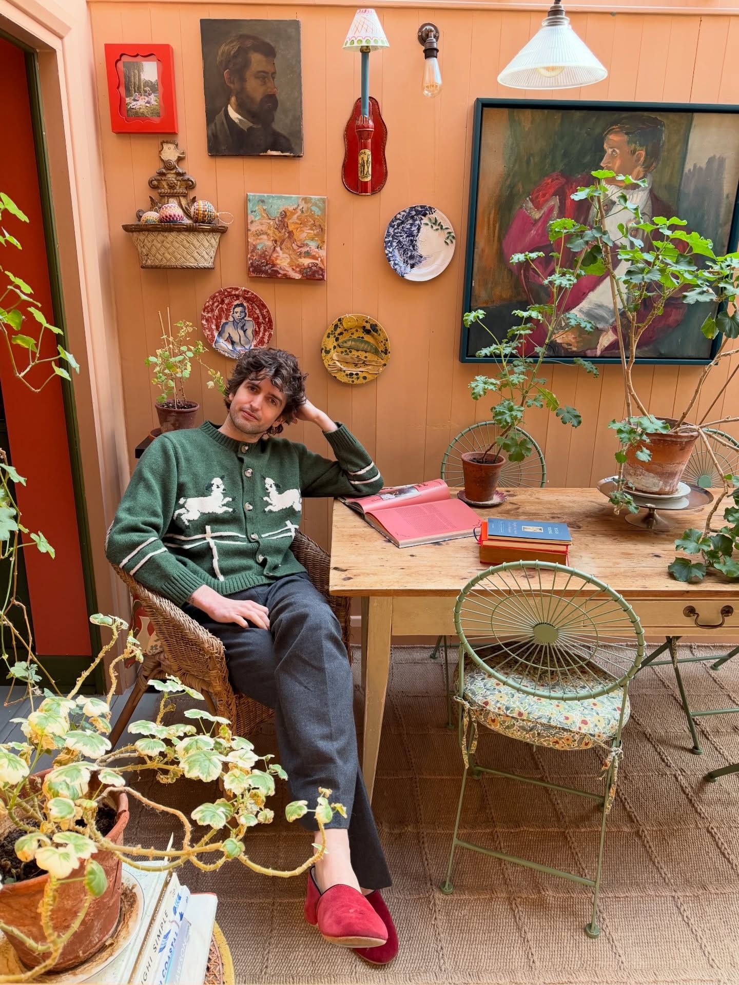 An image of @maximilianhurd wearing a colourful SS Daley knitwear jumper.