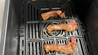 Instant Vortex Slim Air Fryer cooking bacon