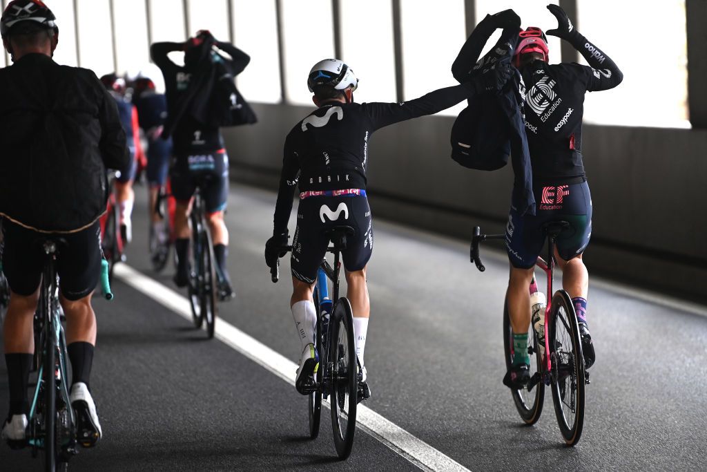 Will Barta of The United States and Movistar Team helps to Alberto Bettiol of Italy and Team EF Education-EasyPost on stage 14