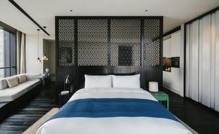 One of the bedrooms featuring an Asia-lite palette of bronze