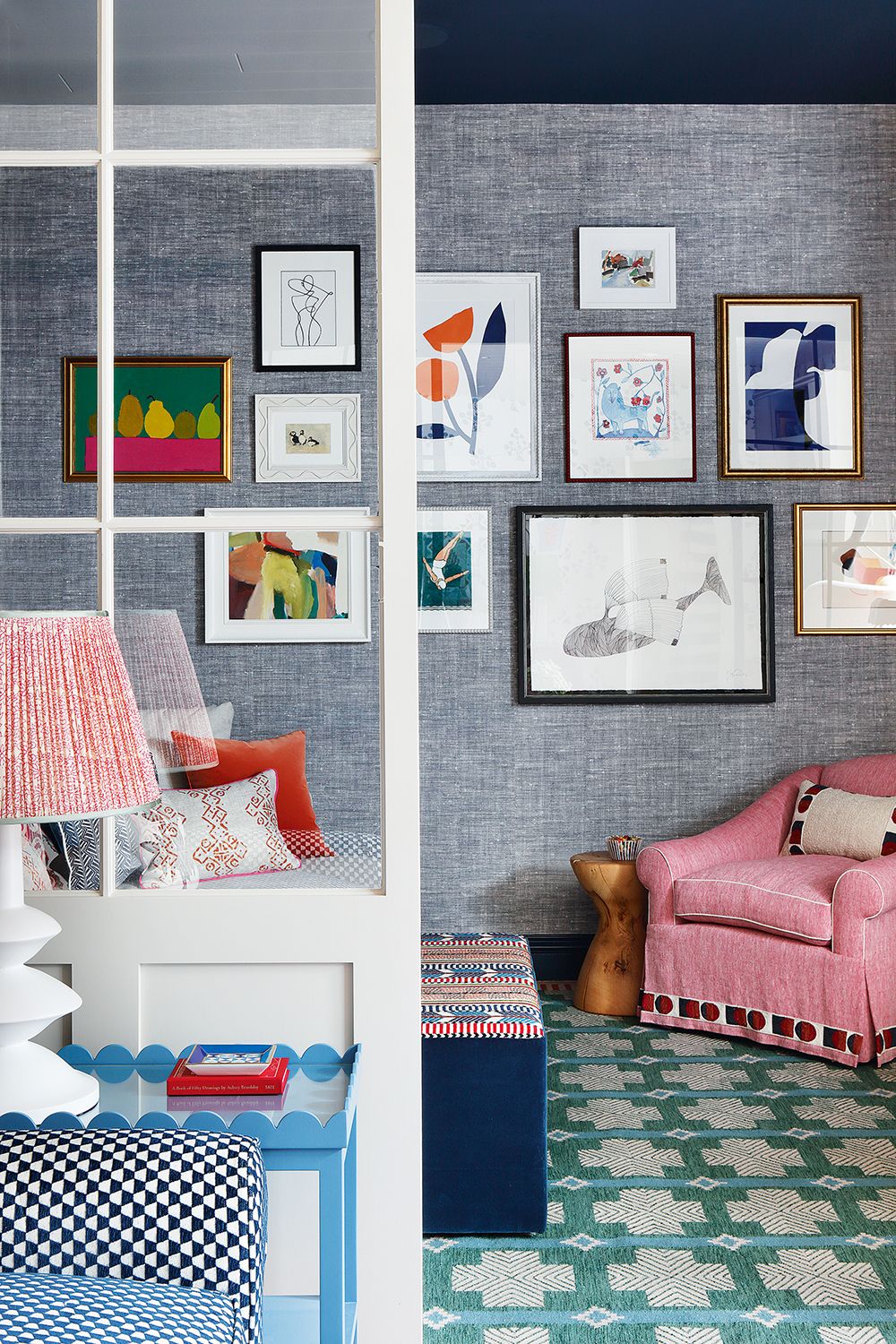 living room with grey textured wallpaper and gallery wall