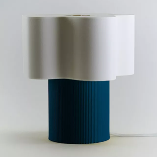 blue and white table lamp with sculptural shade and blue base