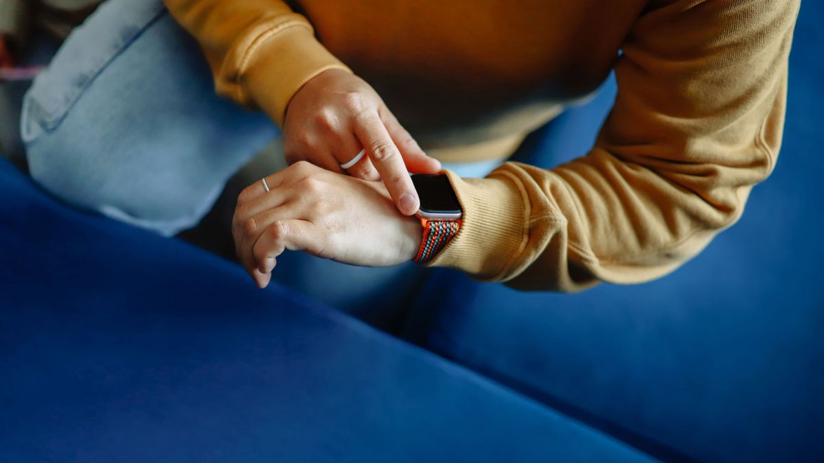 A woman checking her fitness watch