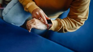 A woman checking her fitness watch