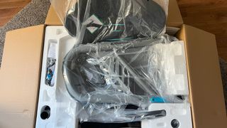 Playseat Trophy Logitech G Edition in its packaging and box, wrapped in various transparent plastics