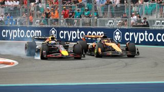 Max Vertsappen and Oscar Piastri racing side-by-side at the Miami Grand Prix