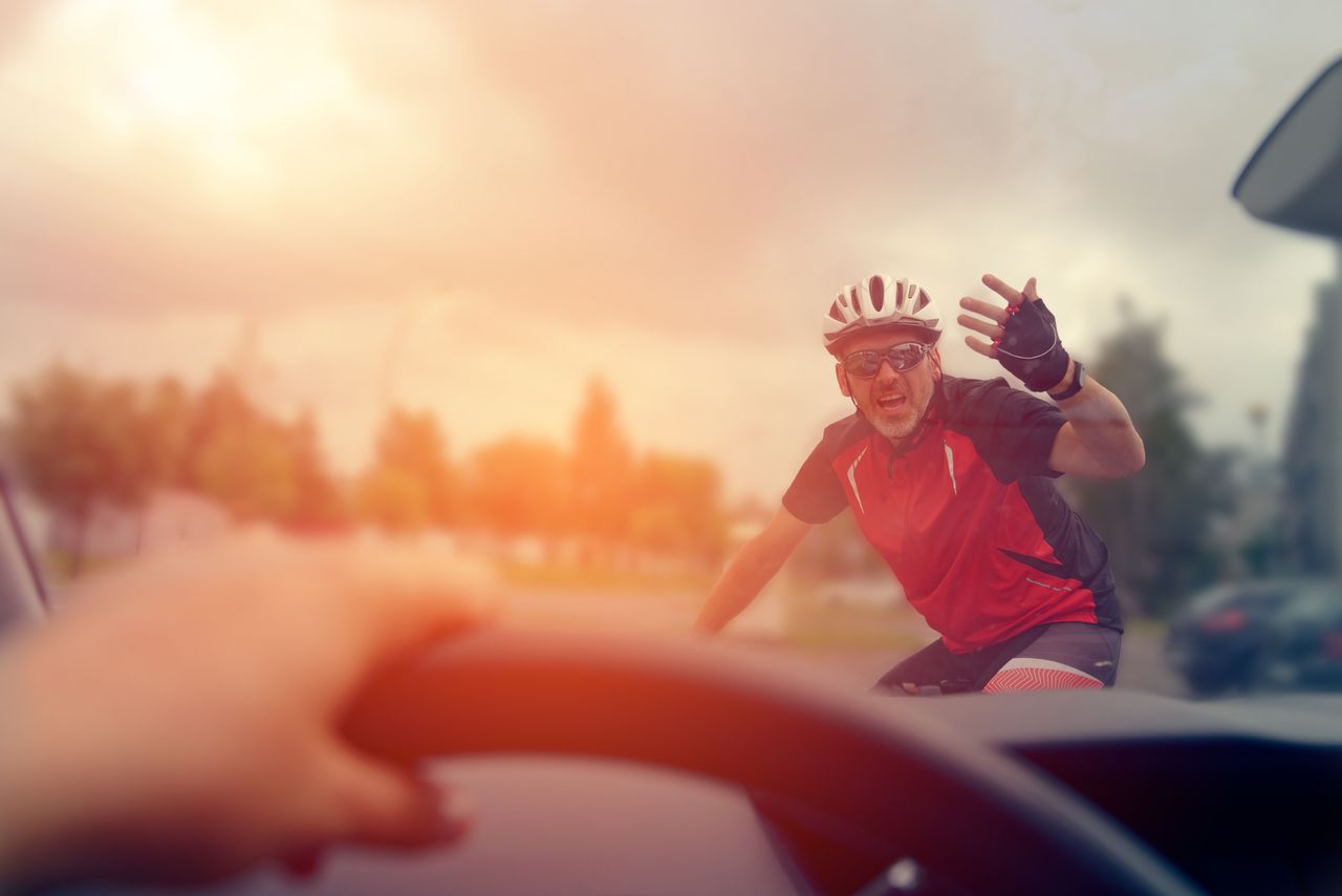 A cyclist argues with a car driver