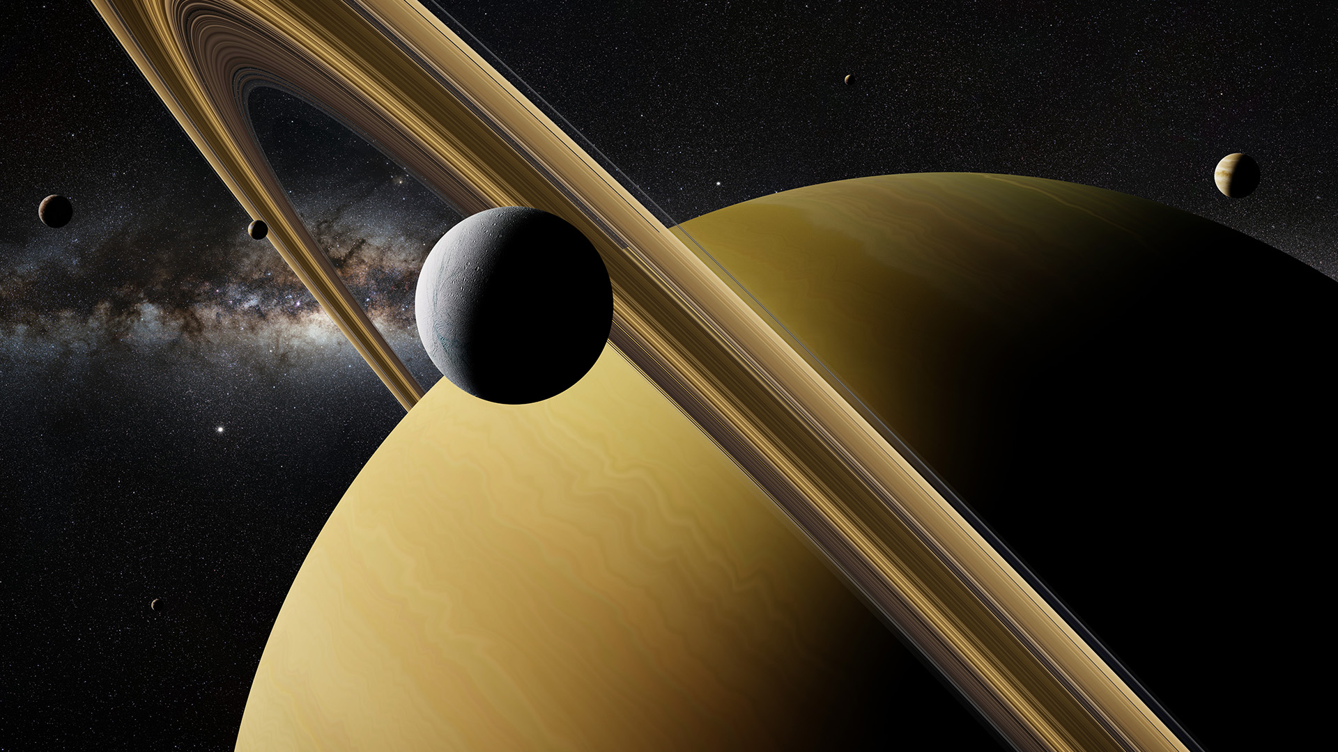 Saturn moon Enceladus in front of planet Saturn, rings and other moons.