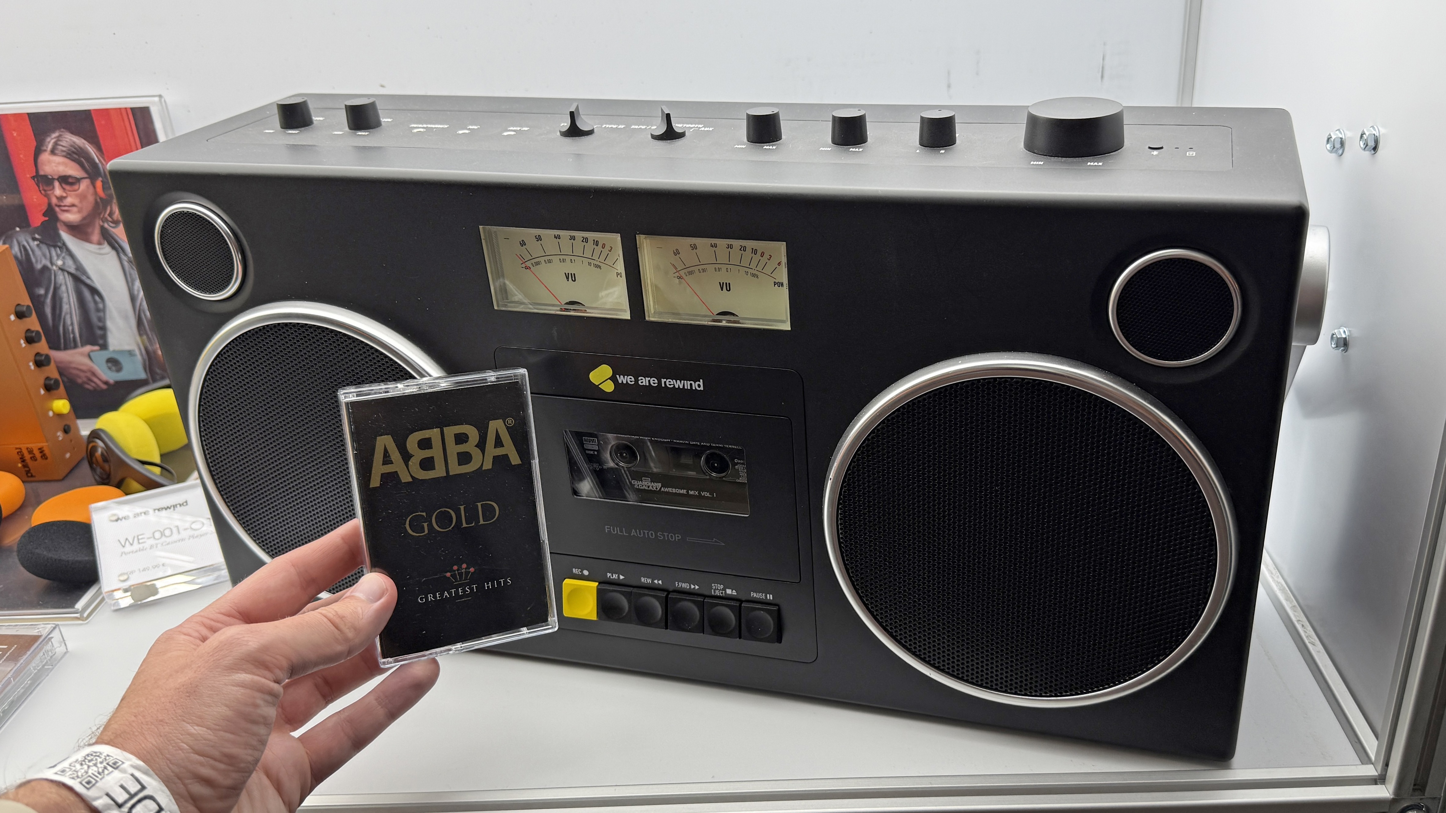 A man holds an Abba tape in front of the We Are Rewind GB-001 boombox