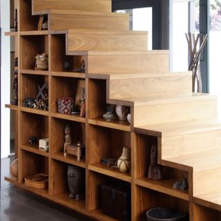 wooden staircase with cabinet design