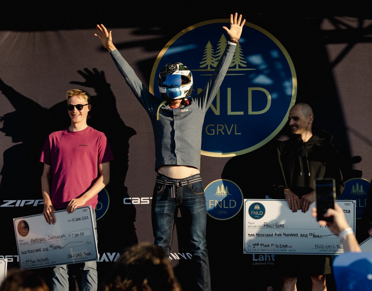 Toms Skujins (Lidl-Trek) dons the F1 helmet as the elite men's winner of 2023 FNDL GRVL