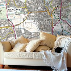 living room with map printed wall