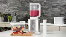 Zwilling Enfinigy Power Countertop Blender blending a berry smoothie
