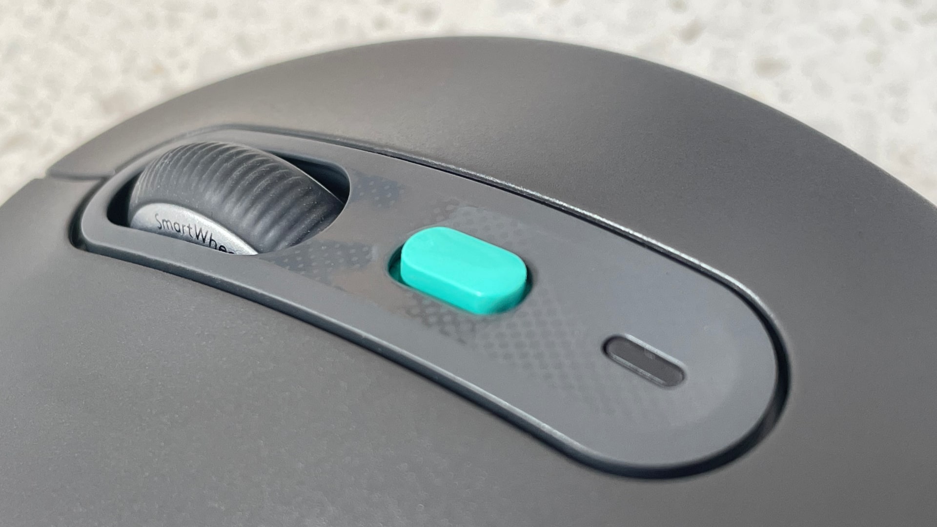 The Logitech Signature AI Edition M750 mouse on a worktop.