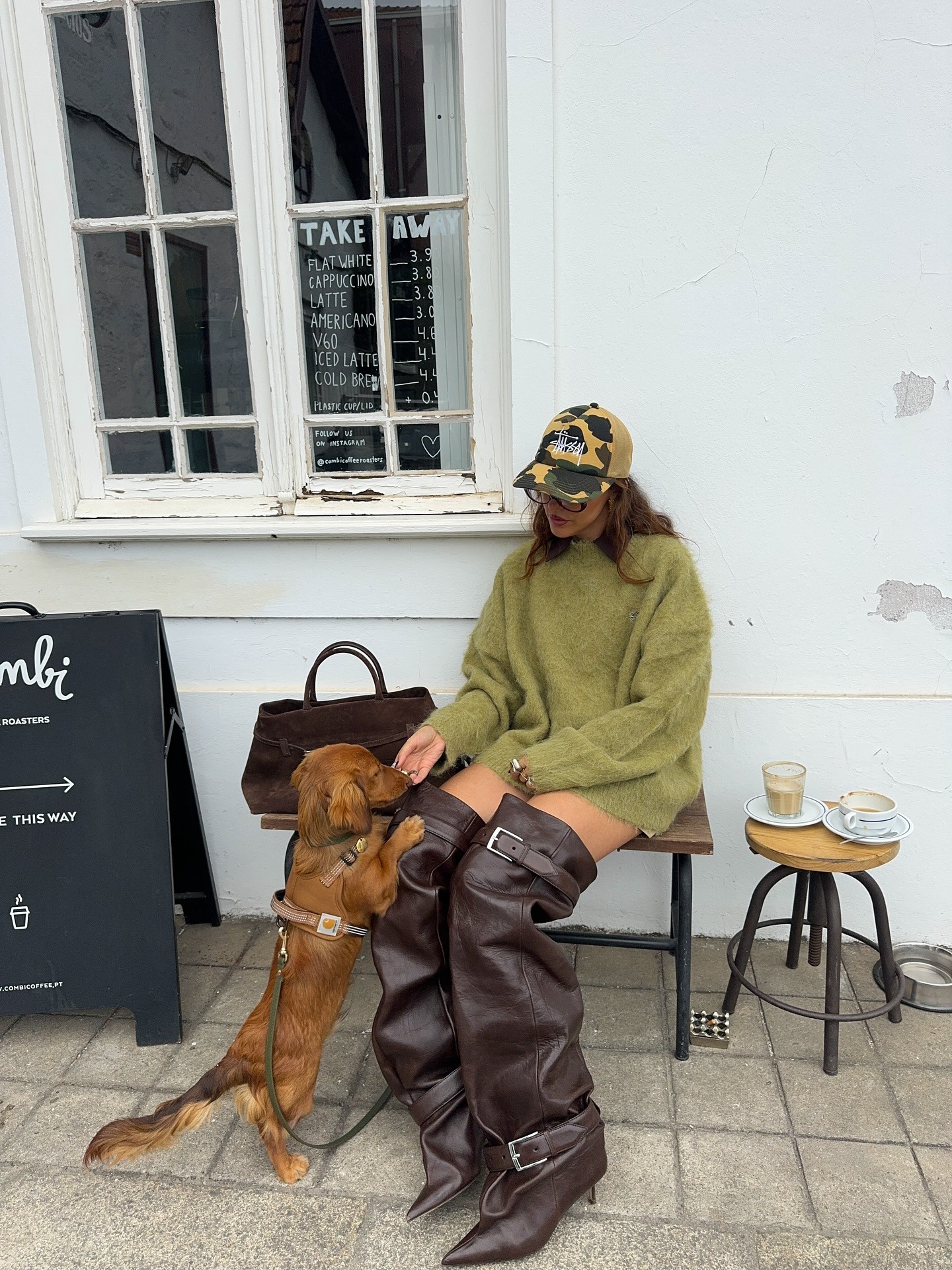 Fashion person Sofia Mcoelho wears London winter shoe trends. She wears slouchy boots.