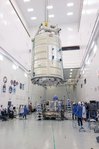 Northrop Grumman engineers mate the Cygnus service module with the pressurized cargo module to complete the S.S. Kalpana Chawla for the NG-14 mission at NASA's Wallops Flight Facility in Virginia.