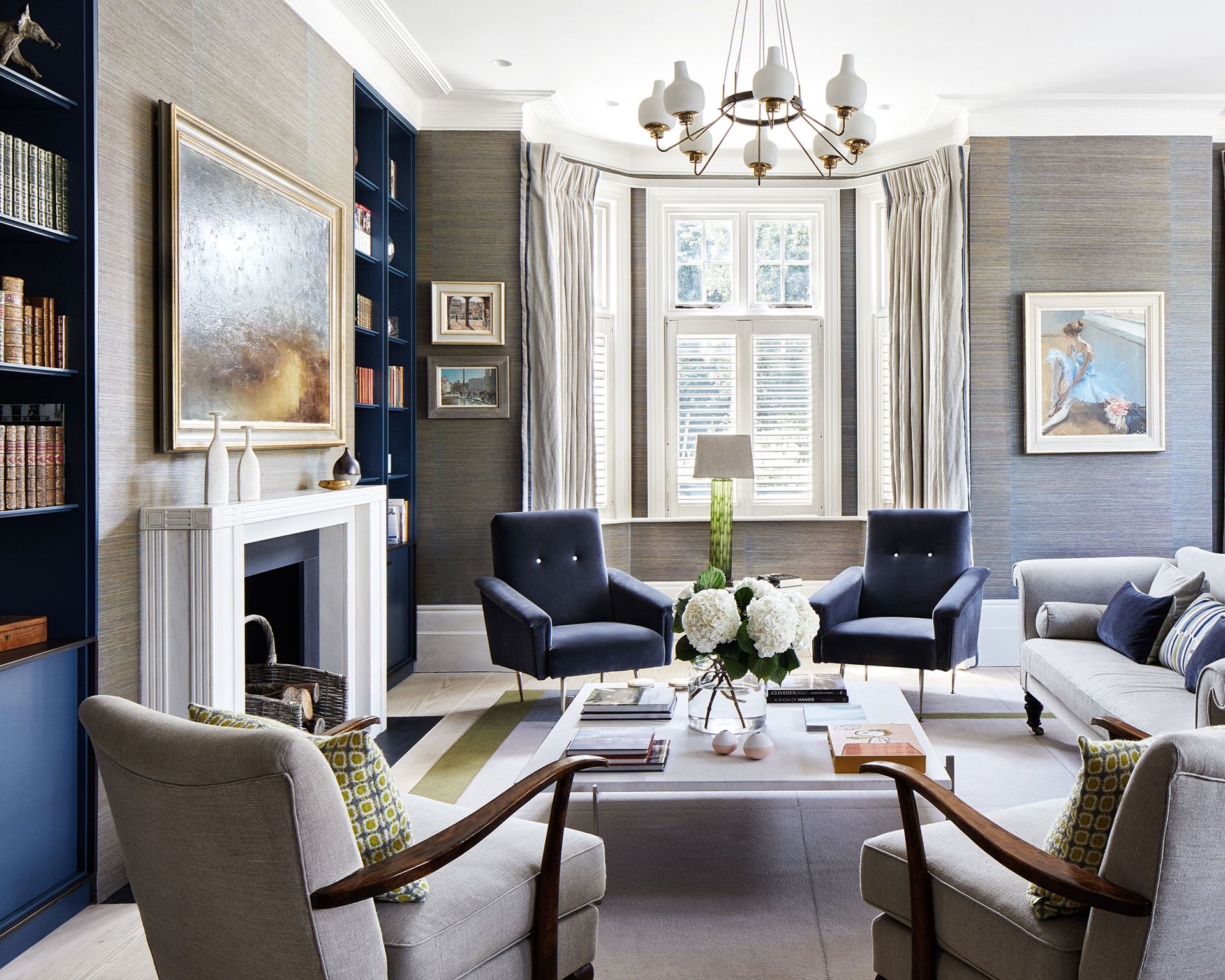 Living room armchairs and coffee table and bookcase alcoves