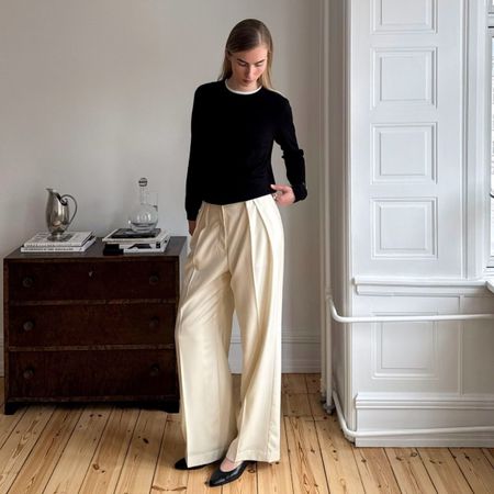 Three women wear minimalist autumn outfits