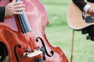 A close-up of a violin being played at a wedding
