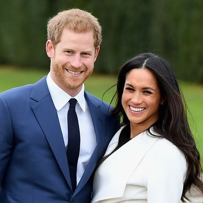 Prince Harry (L) and Meghan Markle during an official photocall to announce the engagement of Prince Harry and actress Meghan Markle at The Sunken Gardens at Kensington Palace on November 27, 2017 in London, England. Prince Harry and Meghan Markle have been a couple officially since November 2016 and are due to marry in Spring 2018. 