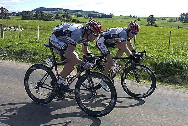 Ben Day (left) and Fly V Australia teammate Phil Zajicek drive the lead group nearing 20 kilometres to the finish.