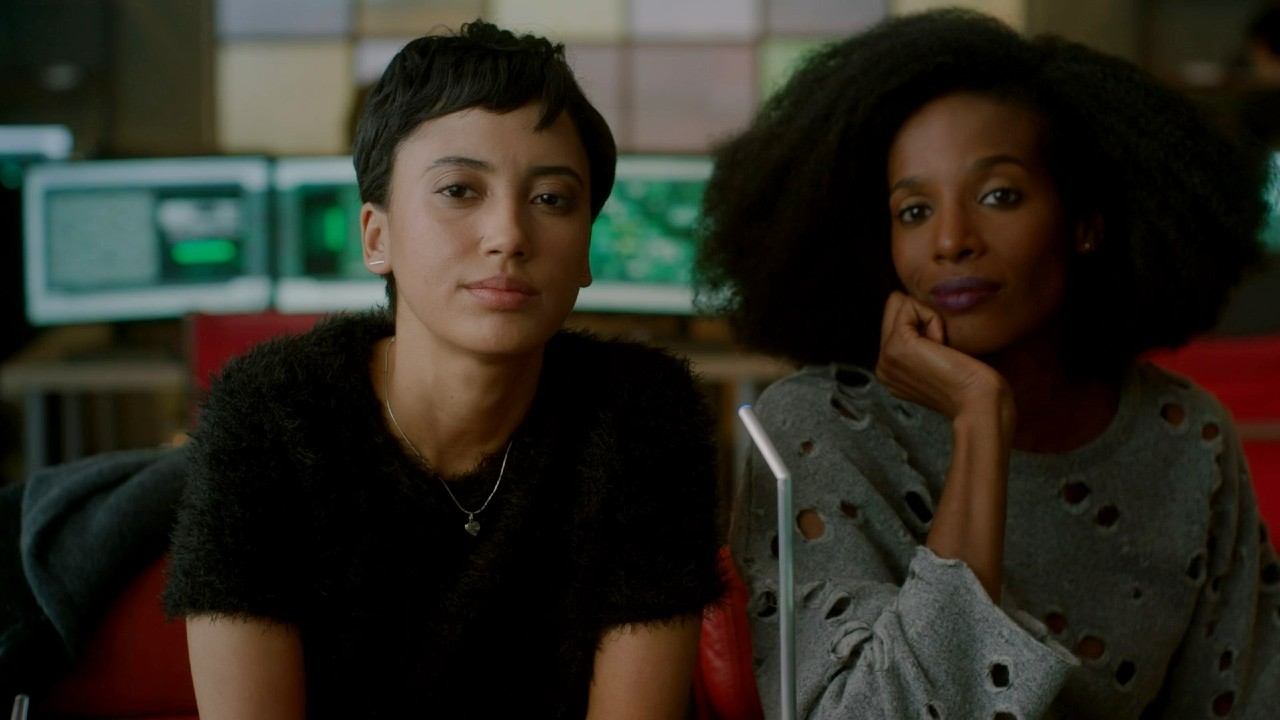 Zainab Johnson and Andy Allo looking ahead in Upload.