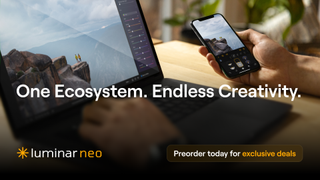 Laptop and smartphone displaying Skylum Luminar Neo 