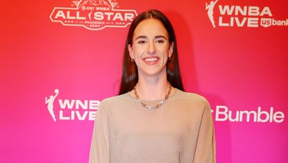 Caitlin Clark on the red carpet at the WNBA All Star game wearing a sheer shirt