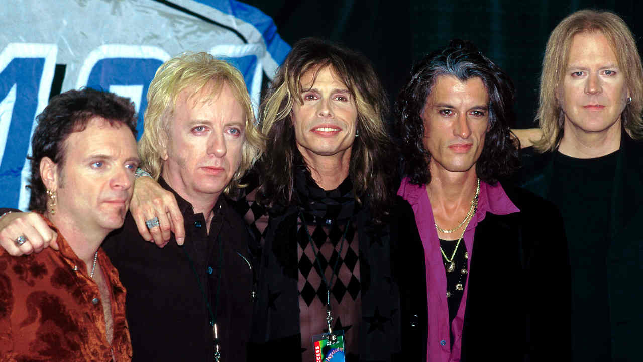 Aerosmith posing for a photograph in the 1990s