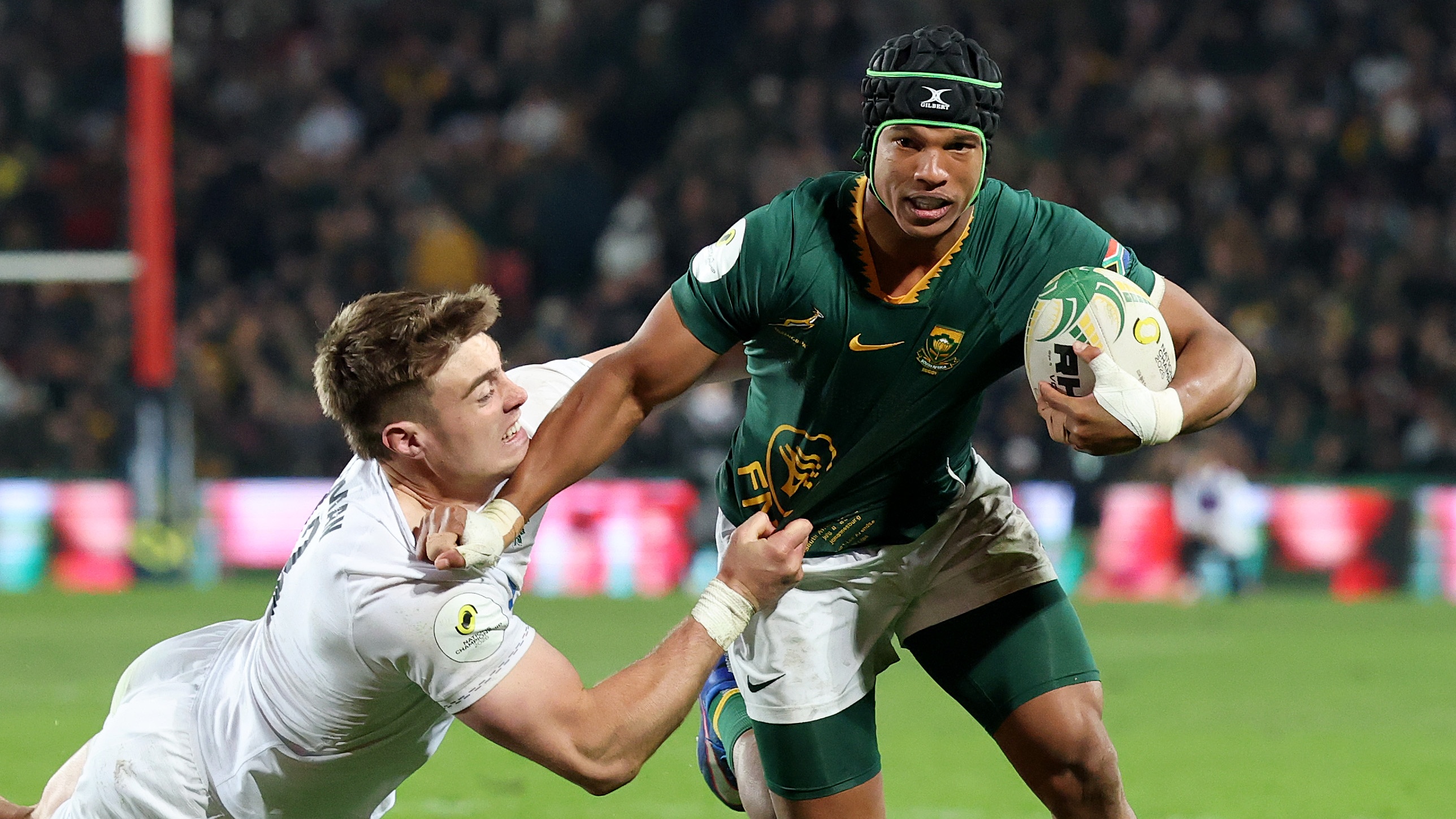 Kurt-Lee Arendse of South Africa is tackled by Tommy Freeman of England during the 2026 Nations Championship match at Ellis Park Stadium on July 04, 2026 in Johannesburg, South Africa