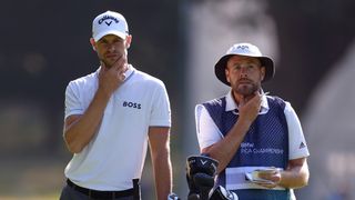 Thomas Detry (left) and caddie Lee Warne both scratch their chins at the 2023 BMW PGA Championship