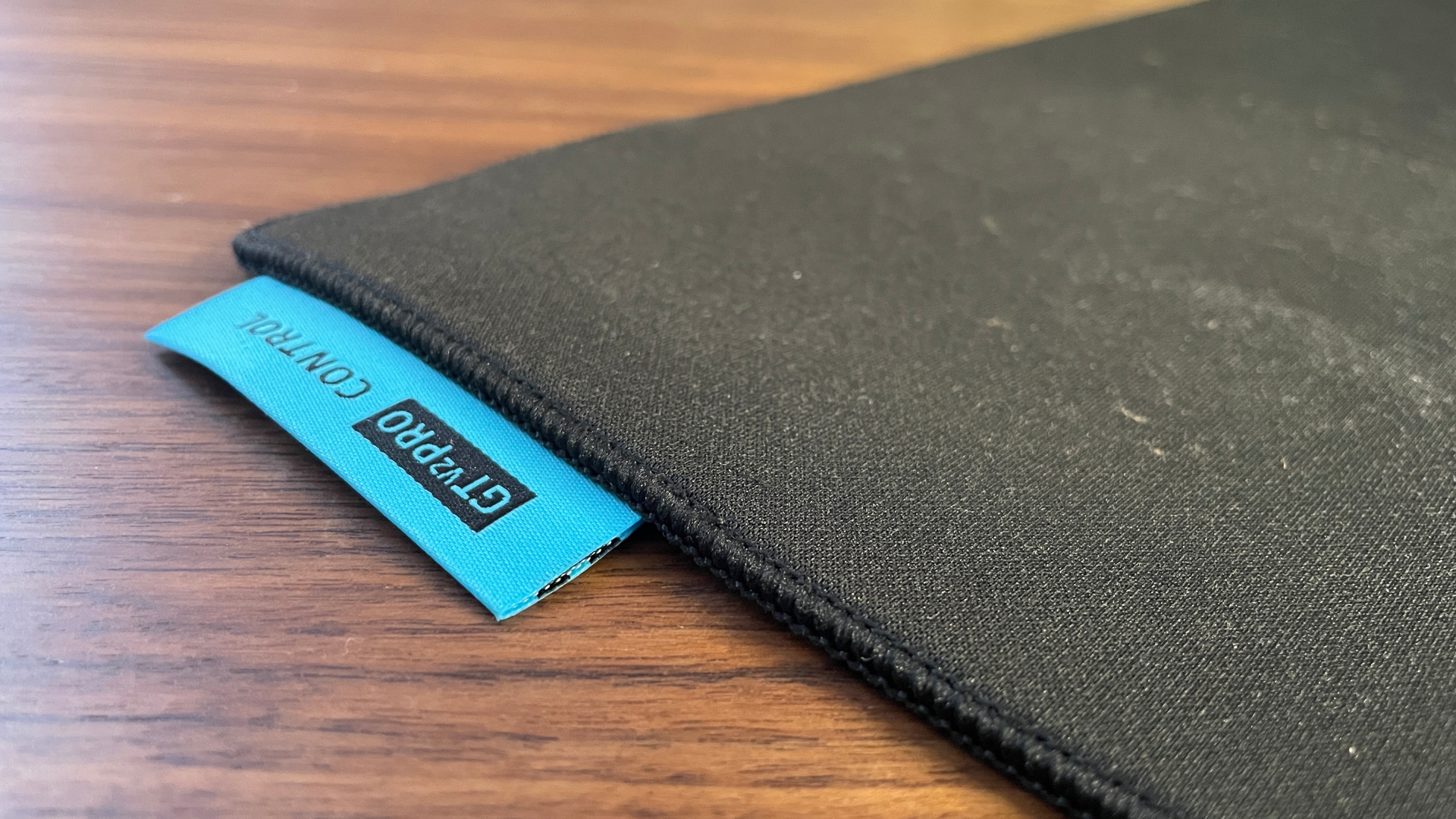 A Razer Gigantus V2 Pro Control mouse pad on a desk.